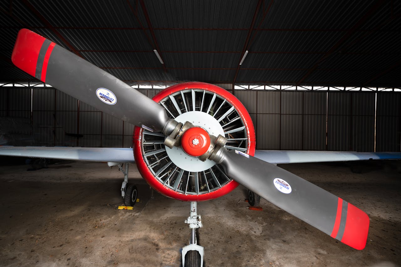 Crafting Captivating Headlines: Your awesome post title goes here A detailed view of a classic propeller aircraft parked indoors in Madrid.